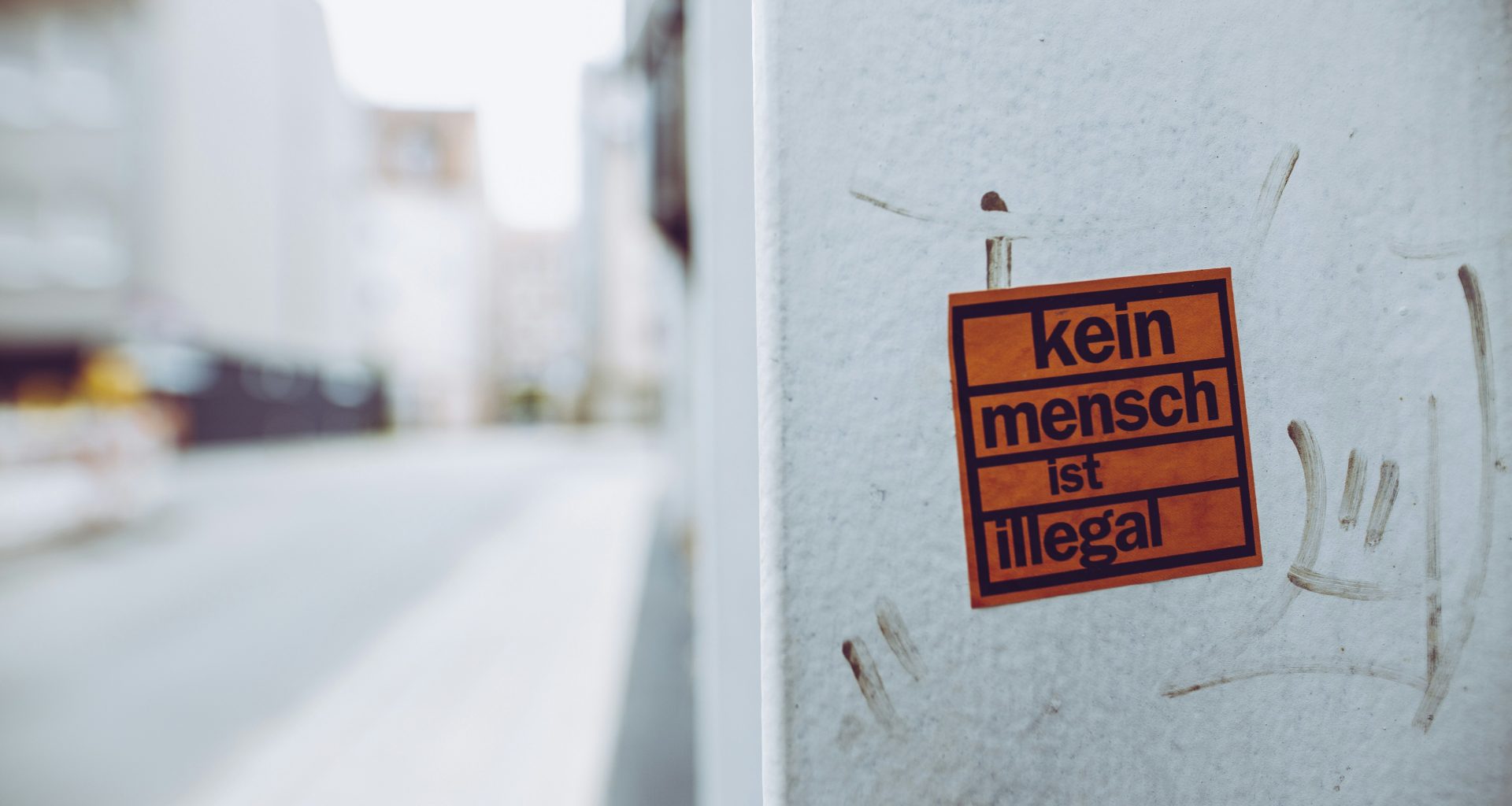 kein-mench-ist-illegal-sign-sticker-XcWtrmI6mpg
