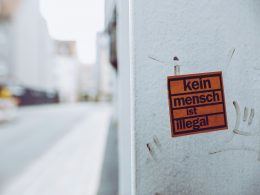 kein-mench-ist-illegal-sign-sticker-XcWtrmI6mpg