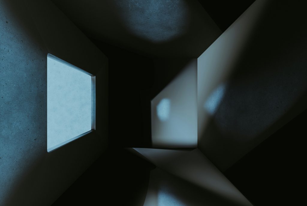 ein-dunkler-raum-mit-einem-kleinen-fenster-darin-TnXu7ib-d6Q