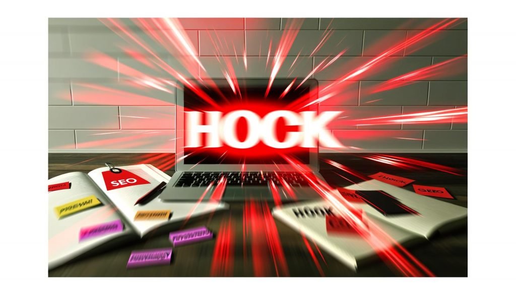 Draufsicht auf einen modernen Büroarbeitsplatz, bei dem ein roter 'HOOK'-Schriftzug intensiv aus einem Laptopbildschirm hervorbricht, umgeben von Notizzetteln mit den Worten SEO, Psychologie und Conversion, alles in scharfen Weiß-, Schwarz- und Rottönen.