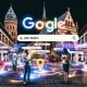 Blick auf die Mainzer Altstadt mit historischen Gebäuden, digitalen Suchleisten mit Begriffen wie SEO Mainz und Google Maps Pins, während Menschen am Smartphone Suchergebnisse betrachten.
