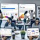 Mehrere Online-Marketing-Teams arbeiten konzentriert in einem hellen Großraumbüro an SEO-Analysen und Google Ads-Kampagnen, während Performance-Dashboards und Suchergebnisse auf Monitoren angezeigt werden.