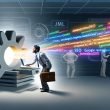 Technik-Nerd mit Laptop und Werkzeugkoffer lehnt am leuchtenden Joomla-Logo, aus dem bunte HTML- und SEO-Symbole hervorquellen, während im Hintergrund ratlose Figuren an SEO-Problemen im Serverraum scheitern.