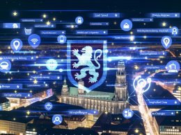 Dynamische, moderne Abendansicht von Braunschweig mit erhellter Innenstadt, lokalen Unternehmen, digitalen Startups, zentralem Löwen-Symbol im Vordergrund und stilisierten SEO- sowie Google-Icons im Hintergrund.