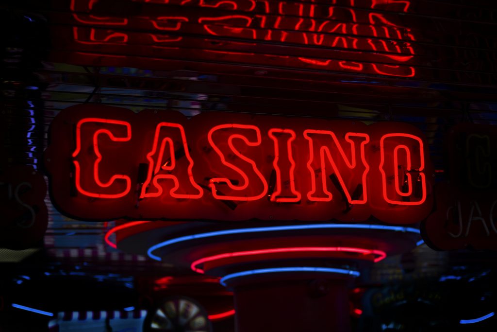 red-casino-neon-sign-turned-on-bYtIpXnzsQM