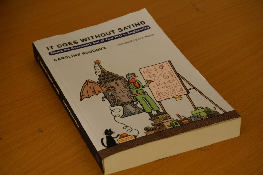 ein-buch-das-auf-einem-holztisch-sitzt-y0Kbug5sNl4