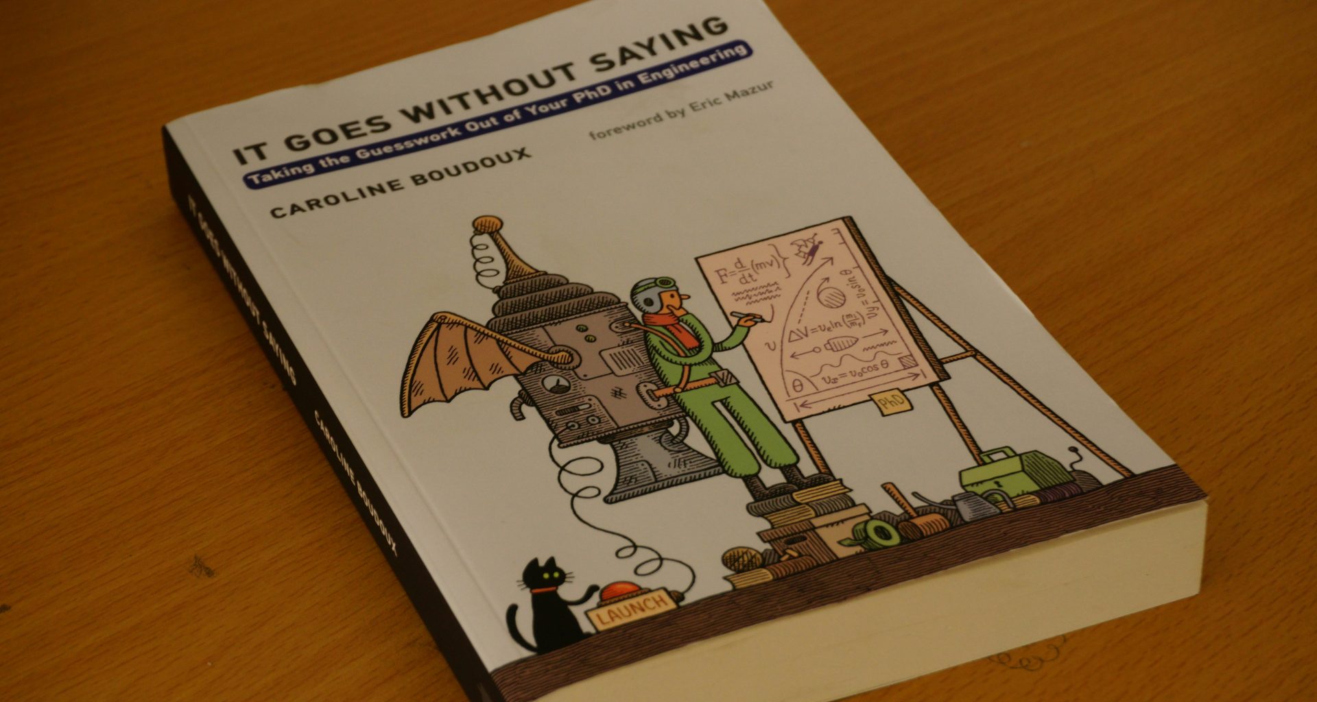 ein-buch-das-auf-einem-holztisch-sitzt-y0Kbug5sNl4