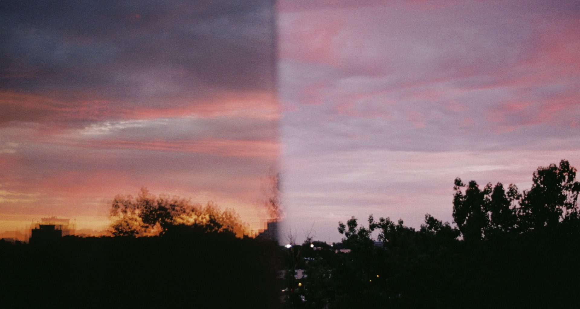 ein-bild-eines-sonnenuntergangs-das-durch-ein-fenster-aufgenommen-wurde-BAchcyGylCQ