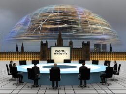 Politiker in dunklen Anzügen umgeben einen runden Tisch mit Namensschild ‚Digitalministerium‘, im Bundestag unter Kabeln, draußen moderne, digitalisierte Skylines