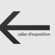 Schwarzer Schriftzug 'salles d'exposition' vor minimalistischem, hellen Hintergrund in einer modernen Ausstellung.