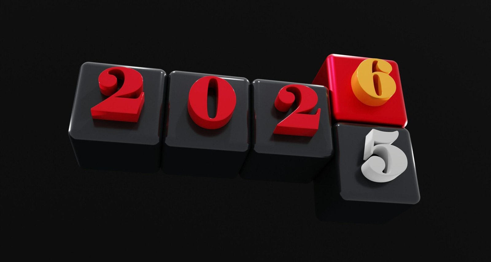 Zwei Holzklötze mit den Zahlen 2025 und 2026 stehen nebeneinander und verweisen auf technologische Zukunftsthemen.