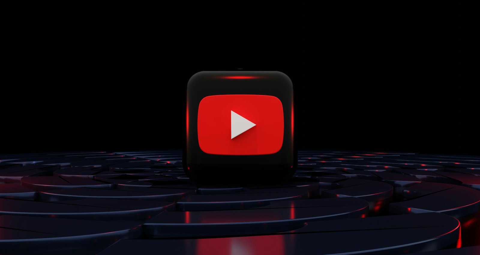 Roter Play-Button vor schwarzem Hintergrund als symbolisches Motiv für digitale Medien und Streaming-Technologie