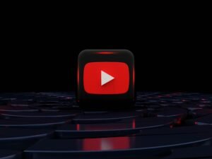 Roter Play-Button vor schwarzem Hintergrund als symbolisches Motiv für digitale Medien und Streaming-Technologie