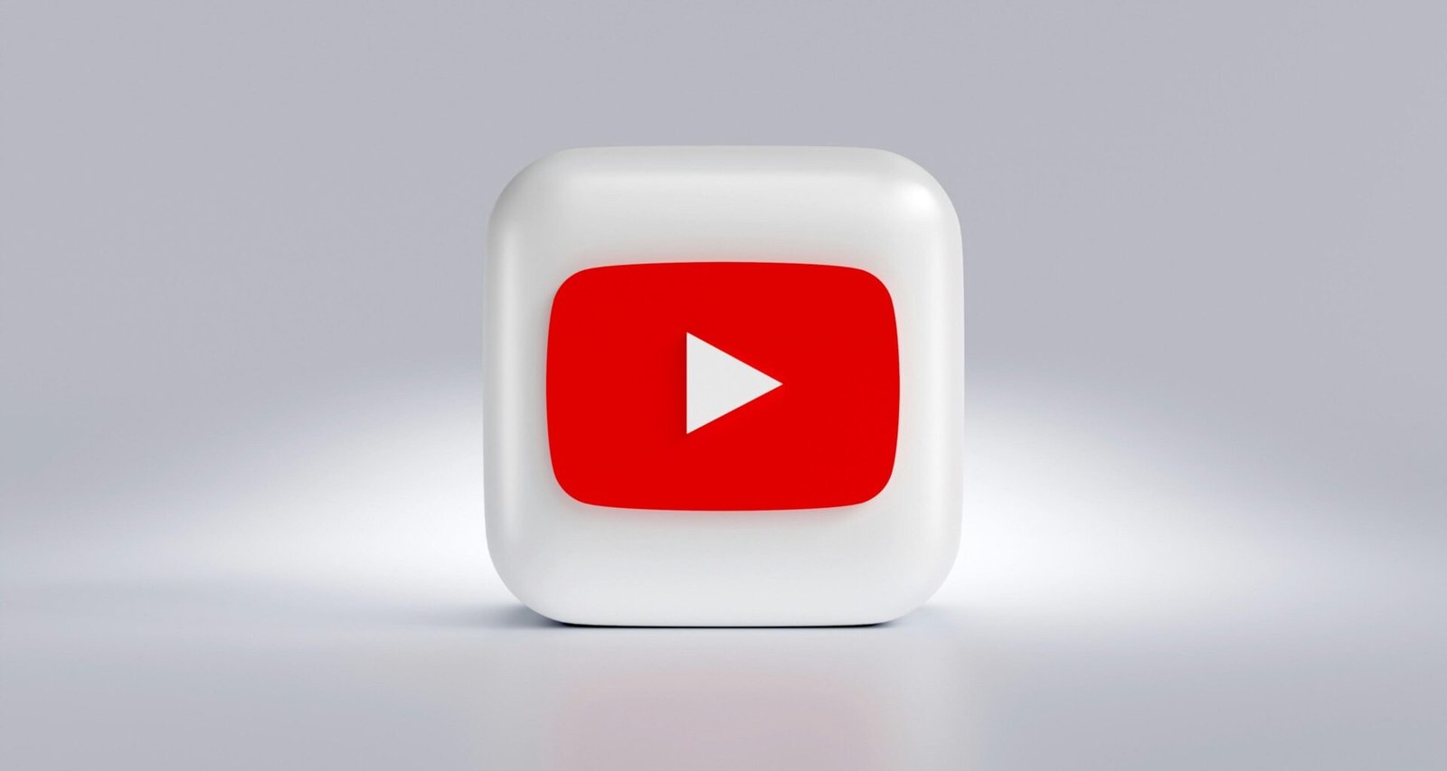 Quadratischer weißer Button mit rotem Pfeil, abstrahiertes Symbol für Navigation oder Auswahl in modernen Webinterfaces