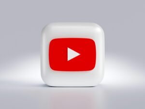 Quadratischer weißer Button mit rotem Pfeil, abstrahiertes Symbol für Navigation oder Auswahl in modernen Webinterfaces