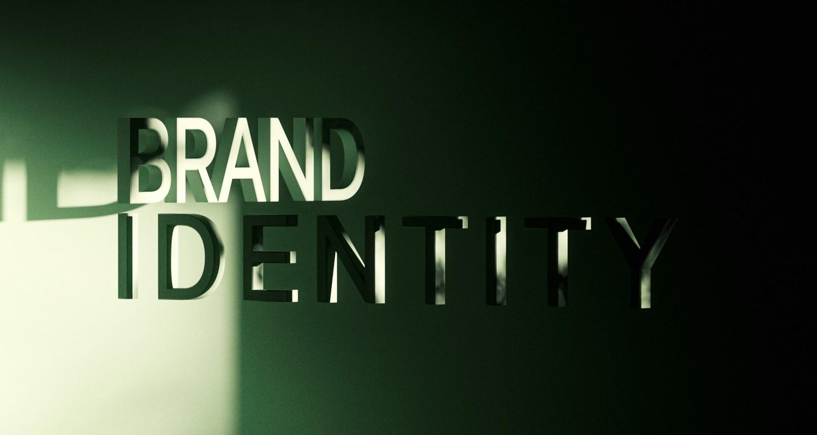 Grüne Wand mit weißem Schriftzug 'brand identity', die ein zentrales Element für Markenidentität visualisiert