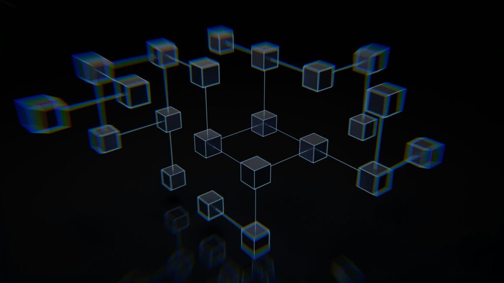 Mehrere Würfel liegen auf einer schwarzen Oberfläche und bilden ein geometrisches Muster, passend als Symbol für Technik-Themen.