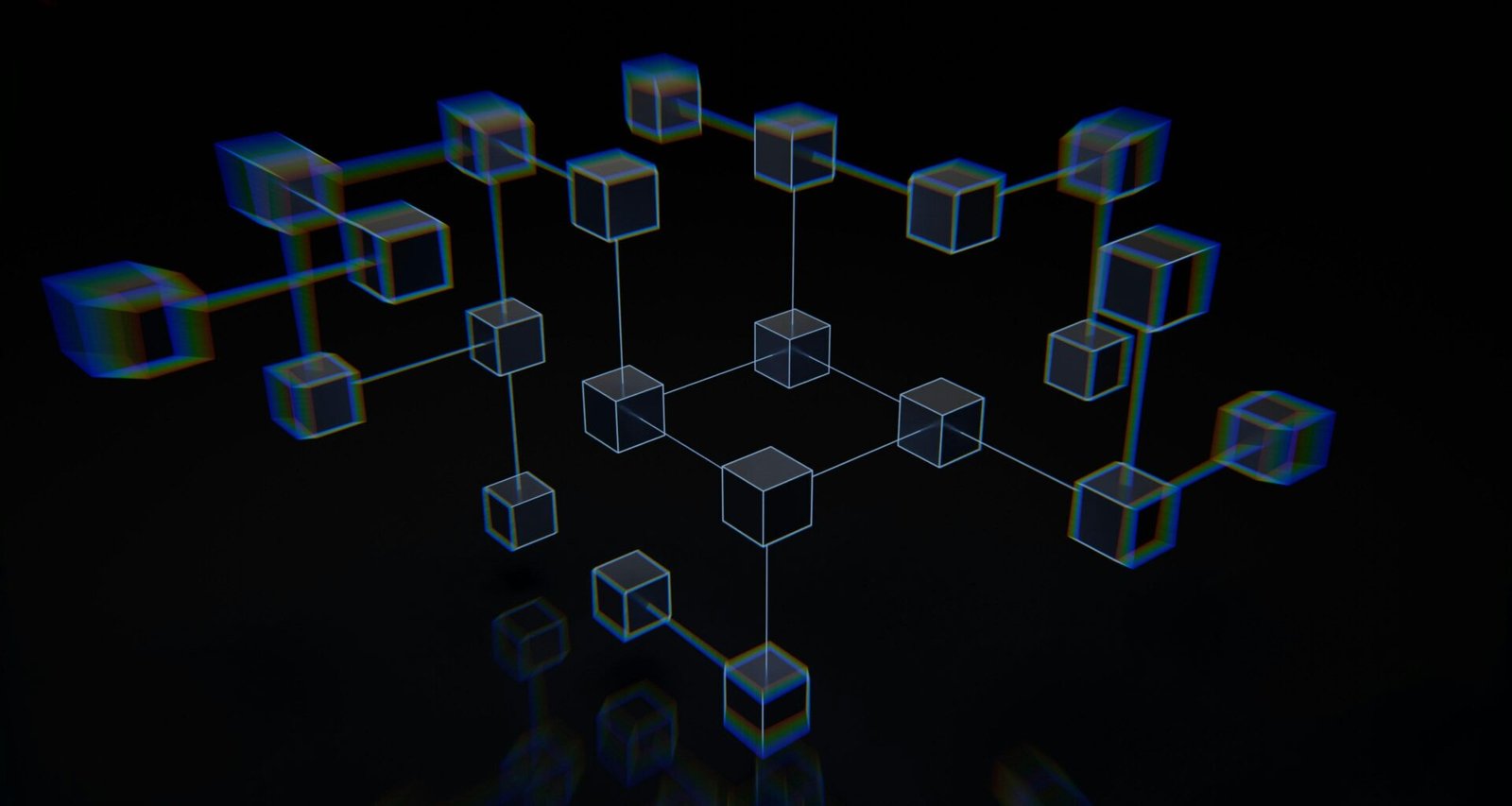 Mehrere Würfel liegen auf einer schwarzen Oberfläche und bilden ein geometrisches Muster, passend als Symbol für Technik-Themen.