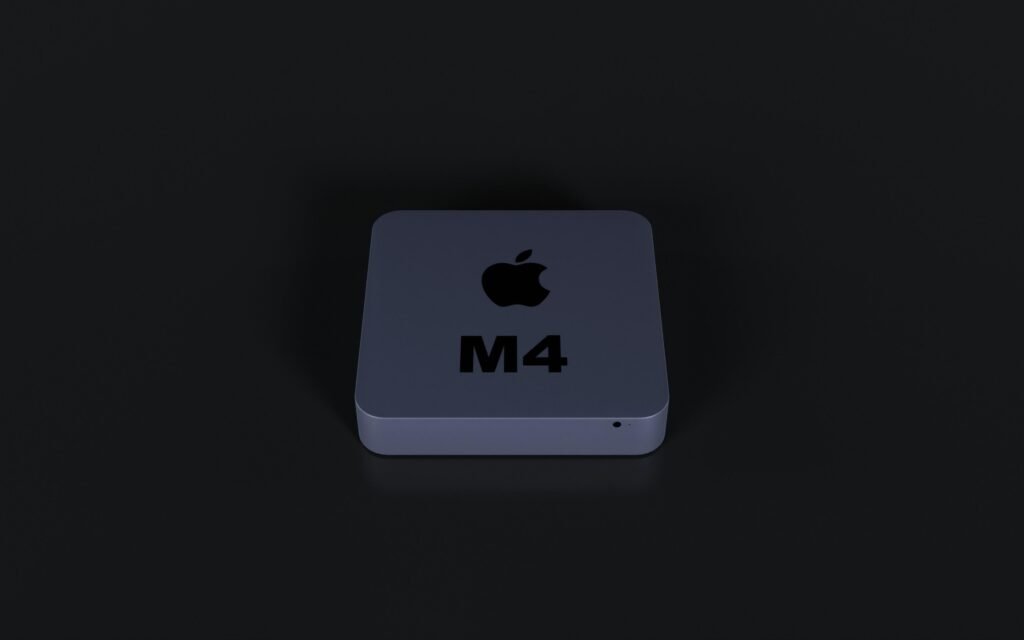 Nahaufnahme eines beleuchteten Apple Logos auf schwarzem Hintergrund, aufgenommen von oben in moderner Studioumgebung.