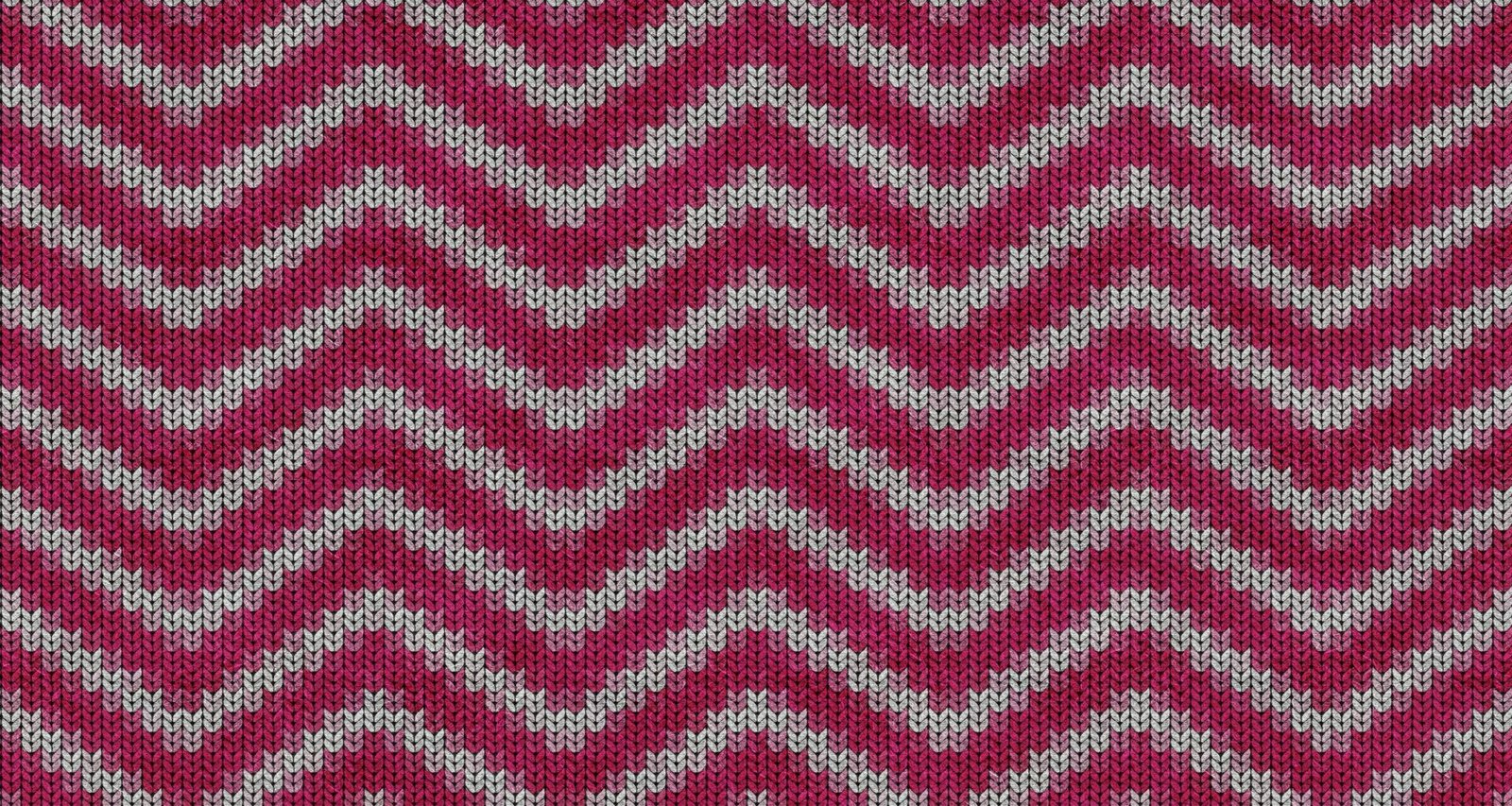 Nahaufnahme eines roten und weißen Chevron-Textilstücks mit klar sichtbarem Zackenmuster und strukturierter Oberfläche