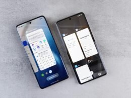 Zwei moderne Smartphones mit unterschiedlichen App-Oberflächen nebeneinander auf einem Tisch platziert