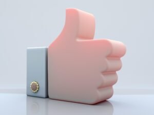 Pinkes Daumen-hoch-Symbol auf weißem Hintergrund als Visualisierung für digitale Zustimmung.