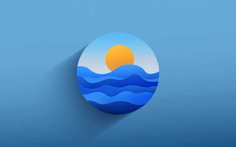 Papiergeschnittene Darstellung eines Sonnenuntergangs über einer Wasserfläche, minimalistischer Kunststil